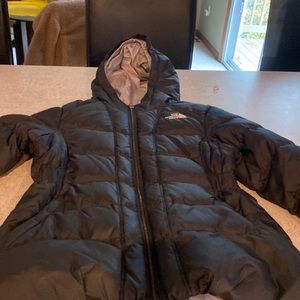 North Face winter jacket.  It is girls large size 14/15. It perfect condition.